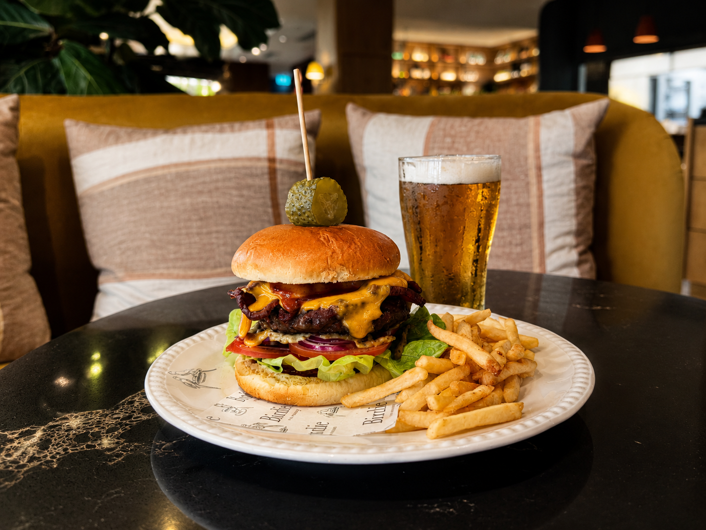Burger and Beer Offer Sydney at Birdie Burger and beer offer Sydney with wagyu cheeseburger, fries and schooner at Birdie